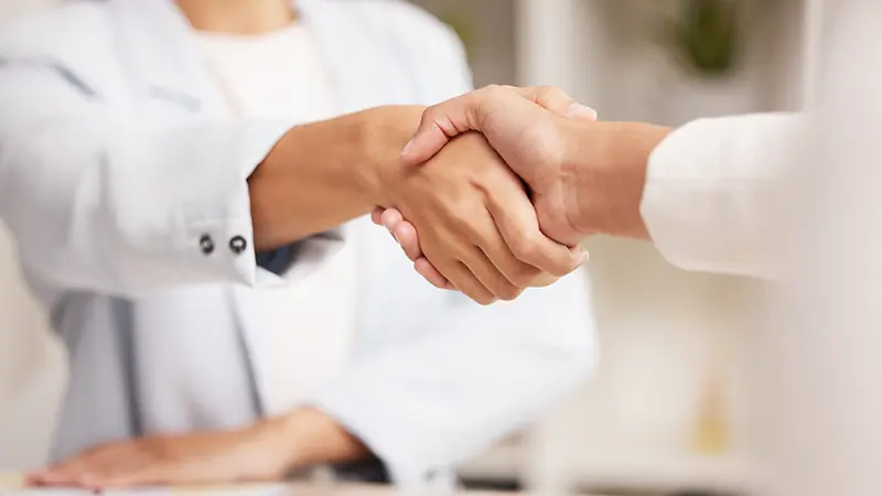 Business handshake representing partnership and trust